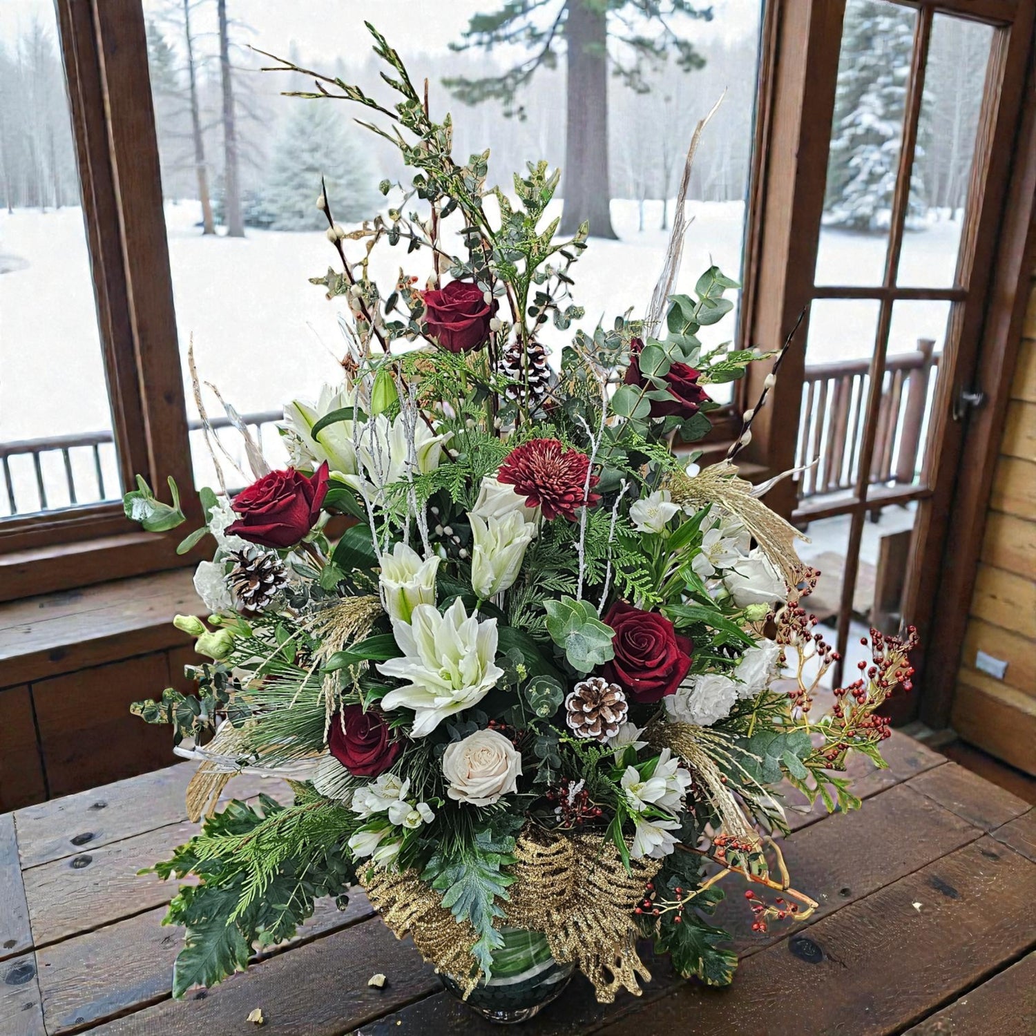 Arrangement floral de Noël rouge et blanc – Élégance festive et naturelle